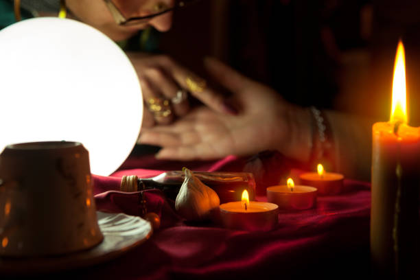 woman fortune teller read a fortune from palm